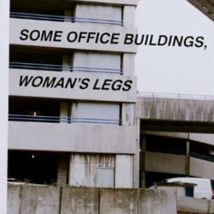 Four Oranges, Some Office Buildings, Woman’s Legs